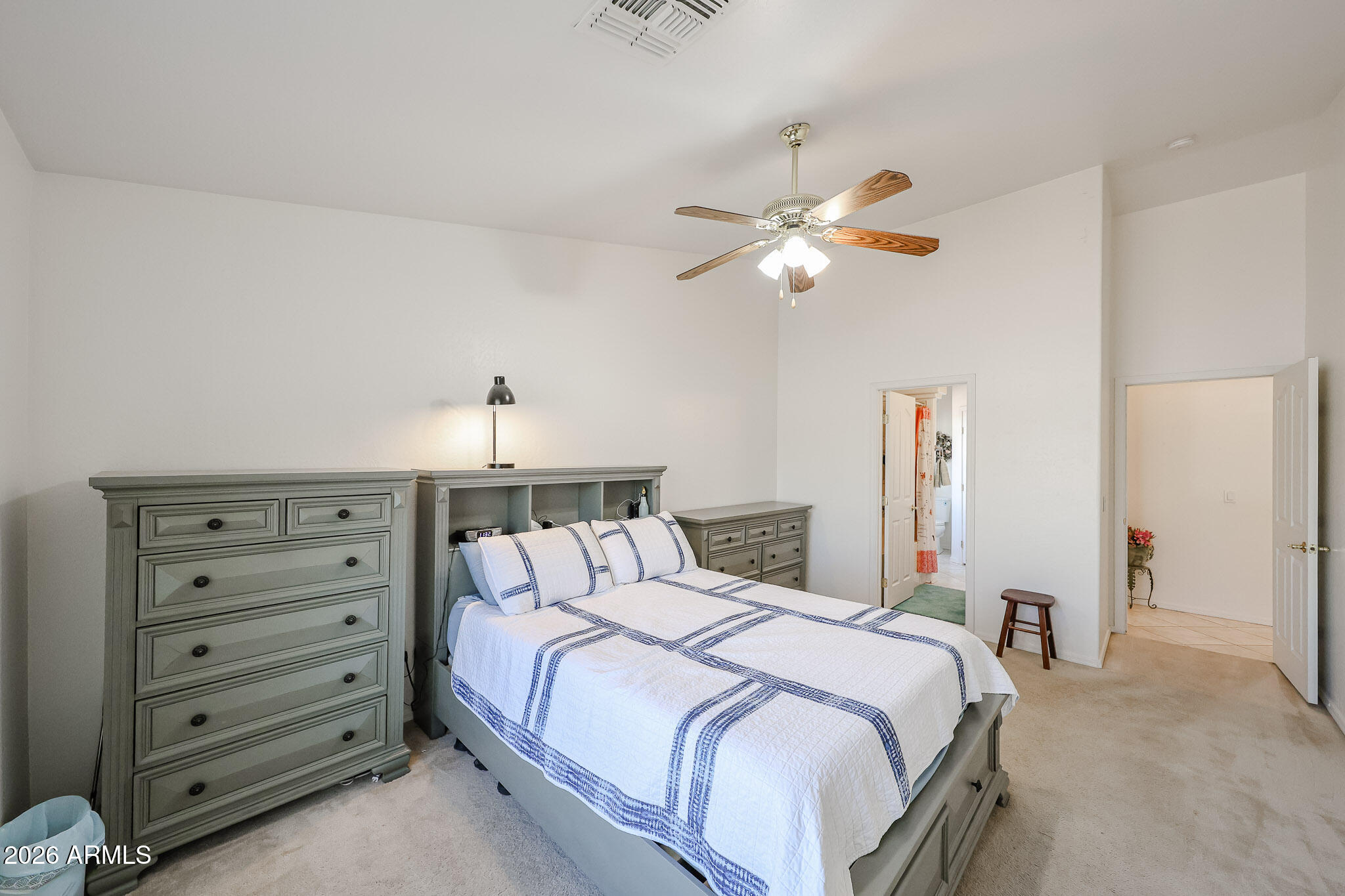 14980 South Capistrano Road Arizona City, AZ 85123 - Photo 15 of 39 a bedroom with a bed and a chandelier