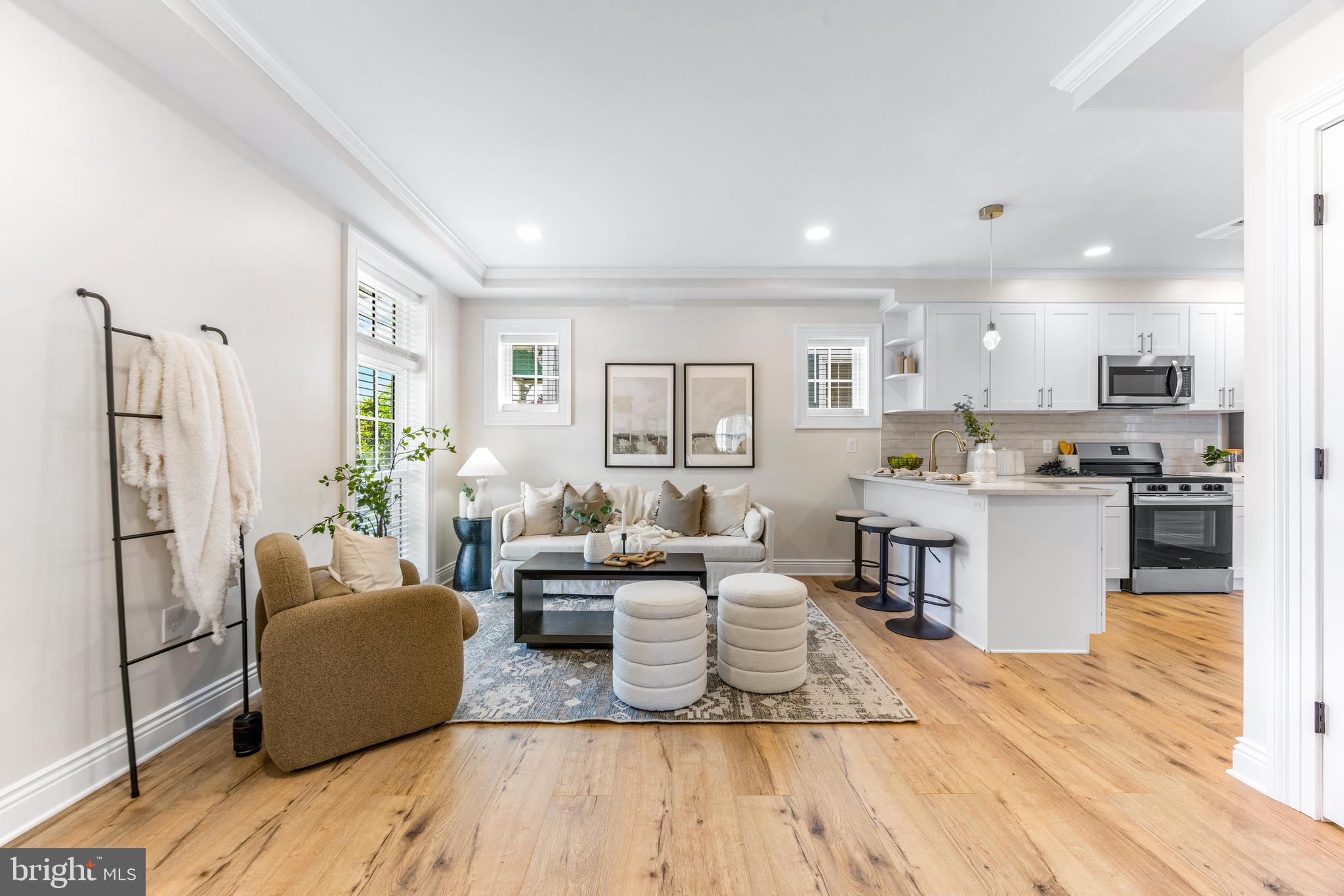 30 East Broadway, Unit AT 1 Bel Air, MD 21014 - Photo 1 of 34 a living room with furniture and a wooden floor