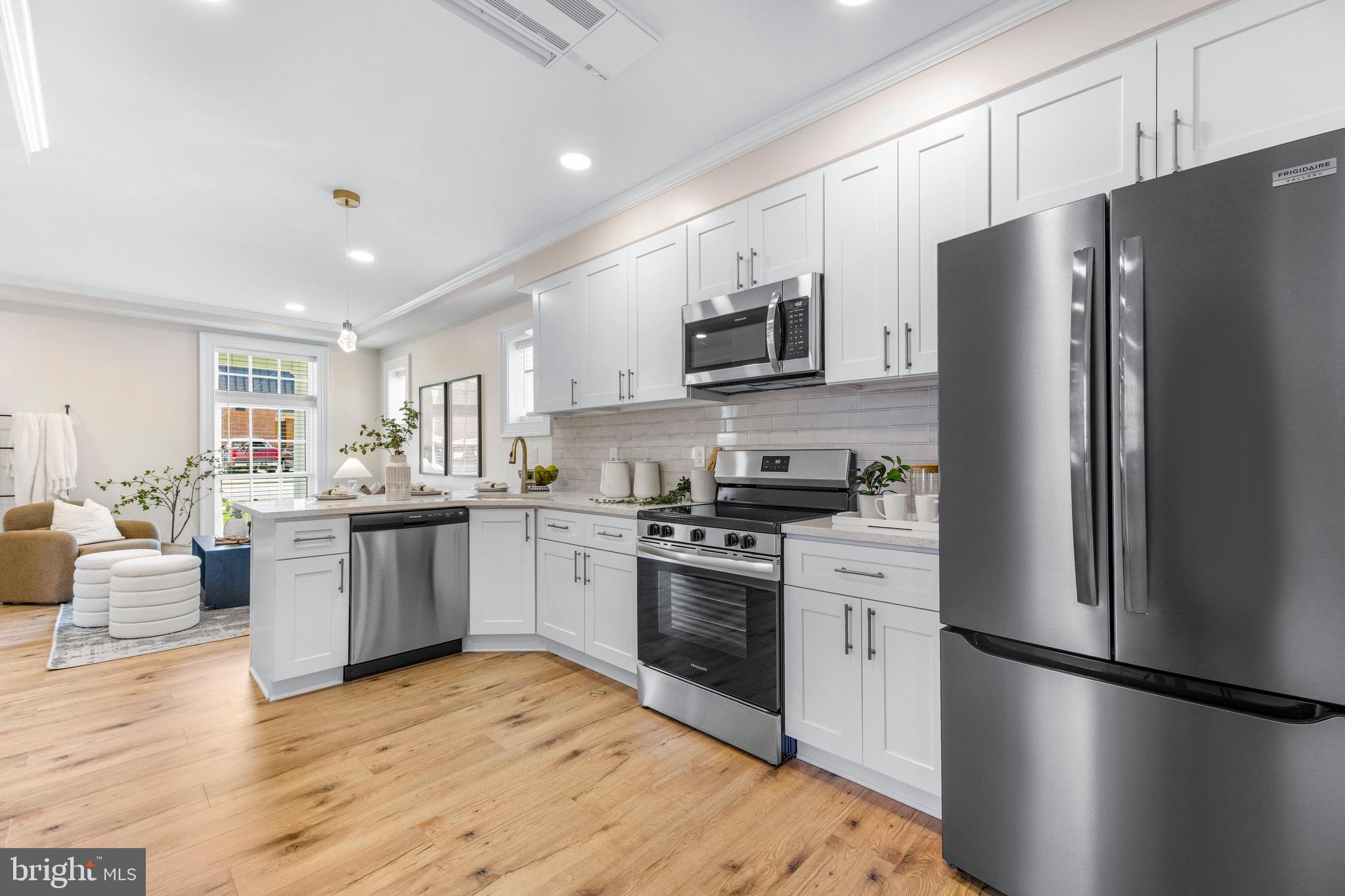 30 East Broadway, Unit AT 1 Bel Air, MD 21014 - Photo 11 of 34 a kitchen with a refrigerator stove and sink