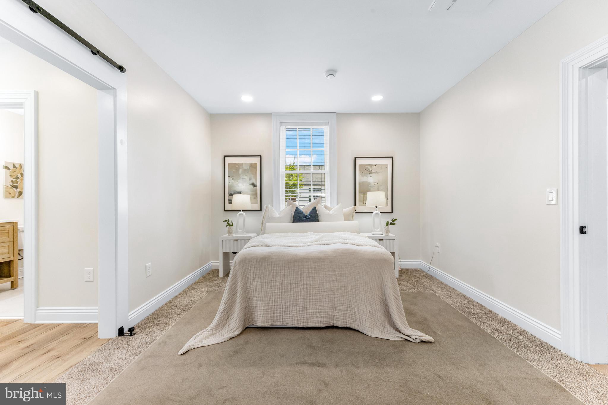 30 East Broadway, Unit AT 1 Bel Air, MD 21014 - Photo 20 of 34 a spacious bedroom with a bed and a window