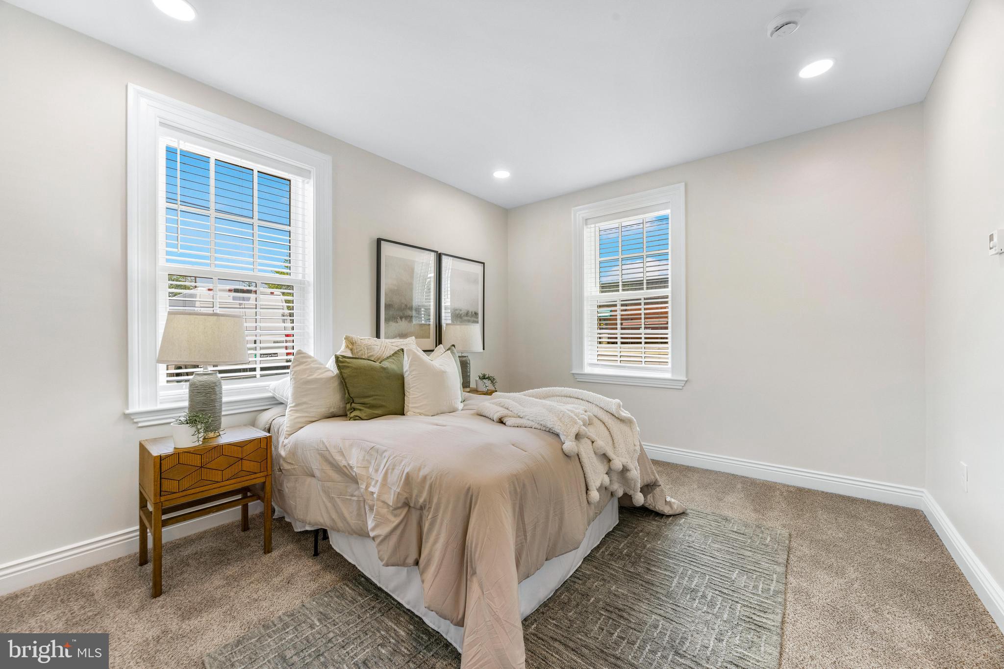 30 East Broadway, Unit AT 1 Bel Air, MD 21014 - Photo 26 of 34 a bedroom with a bed wooden floor and lamp