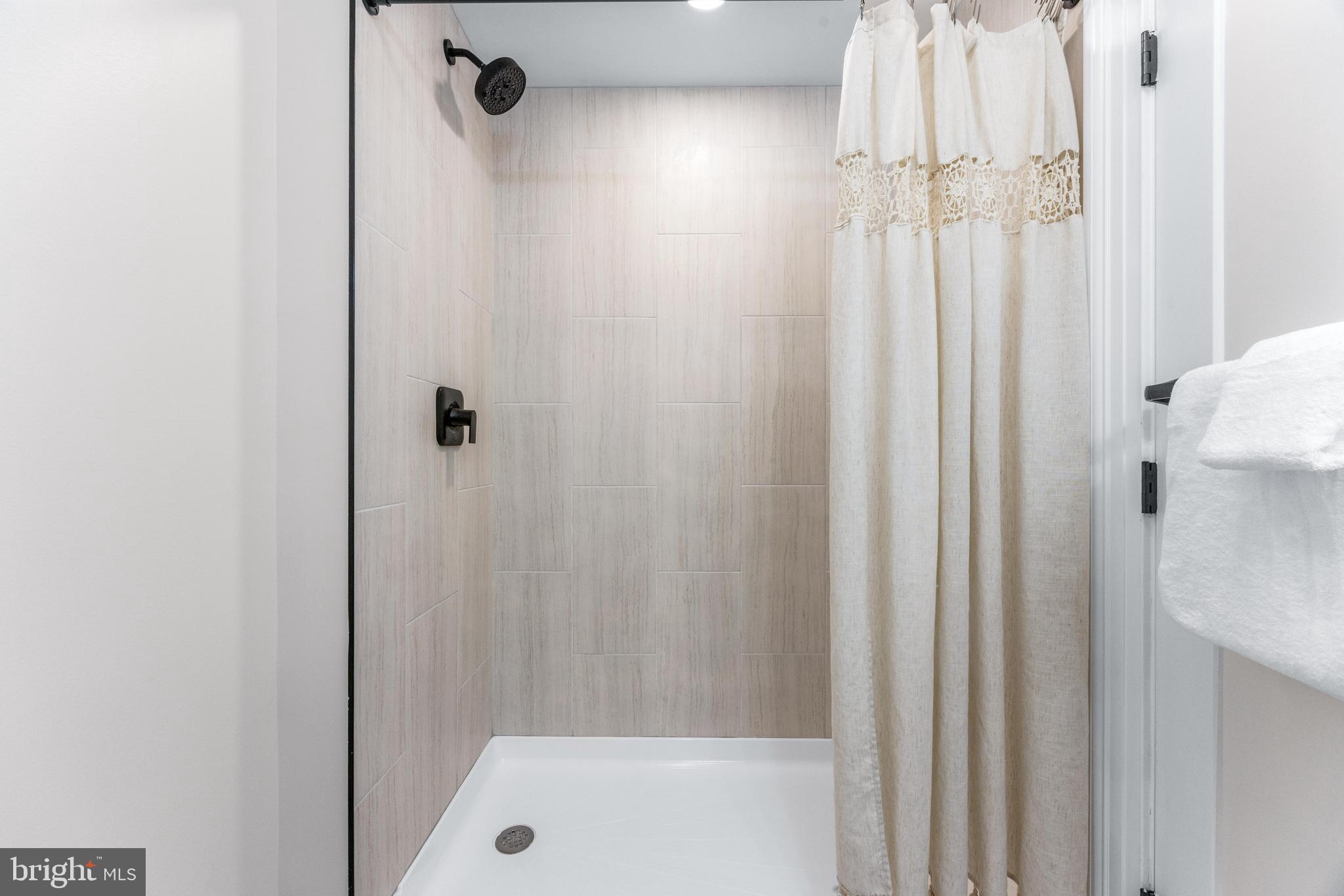 30 East Broadway, Unit AT 1 Bel Air, MD 21014 - Photo 30 of 34 a bathroom with a tub and shower