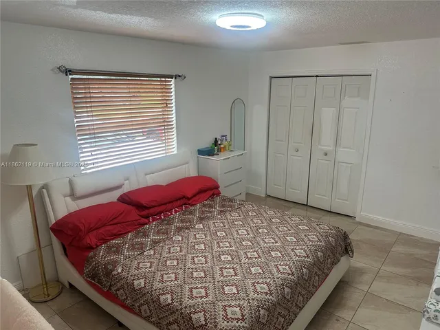 a view of a back yard from a balcony