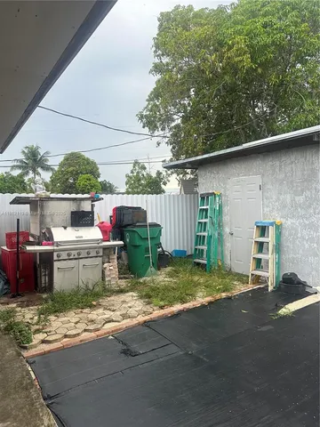 an aerial view of a house with a garden
