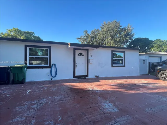 an aerial view of a house with swimming pool