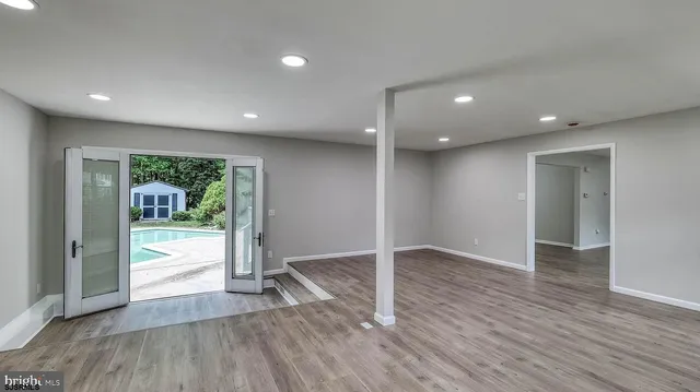 a kitchen with a refrigerator and a sink
