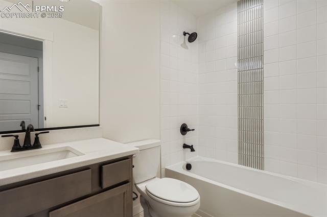 7989 Polson Drive Colorado Springs, CO 80908 - Photo 19 of 28 Bathroom with vanity and bathtub / shower combination