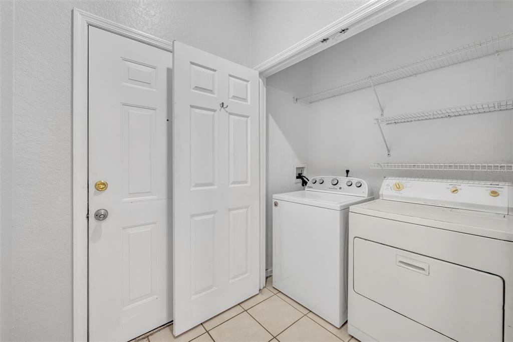 582 Brantley Terrace Way, Unit 304 Altamonte Springs, FL 32714 - Photo 28 of 30 a utility room with dryer and washer