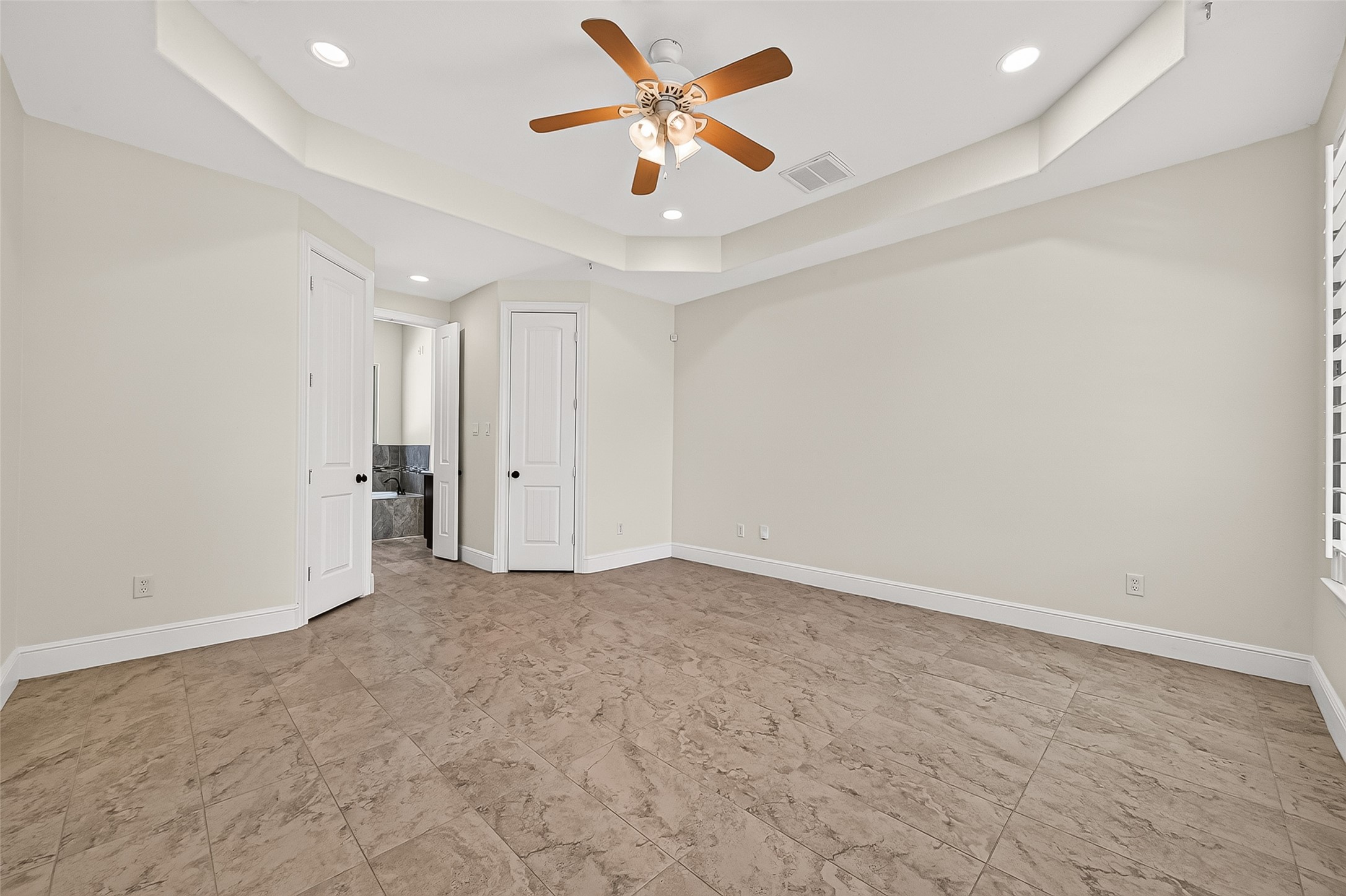 22040 Robins Road Hockley, TX 77447 - Photo 19 of 44 Tiled floor in primary bedroom