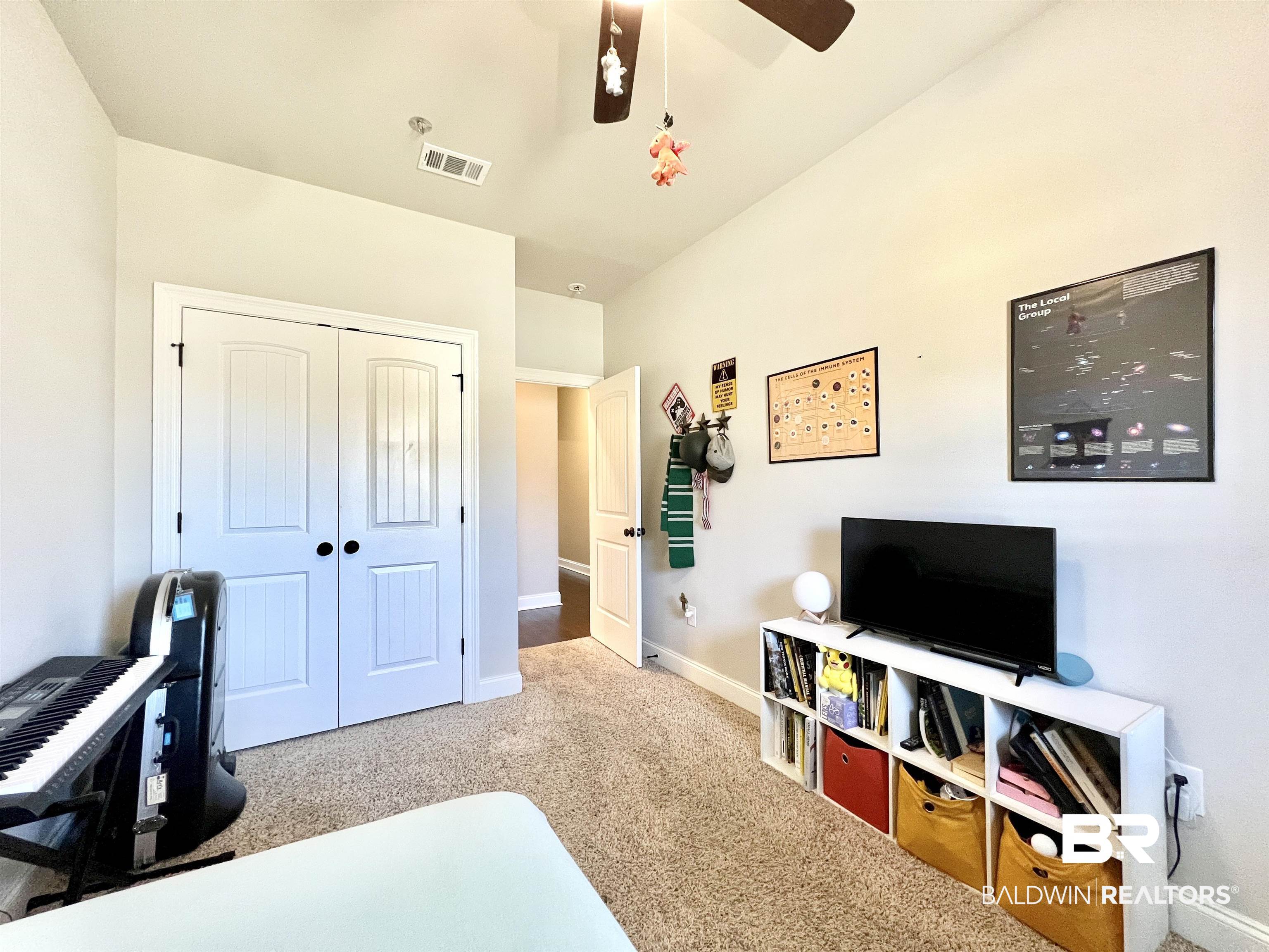 32290 Calder Court Daphne, AL 36527 - Photo 28 of 59 Carpeted bedroom with a closet and ceiling fan