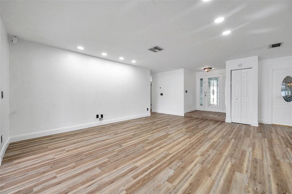 1520 Windmill Pointe Road Palm Harbor, FL 34685 - Photo 11 of 64 a view of empty room with wooden floor