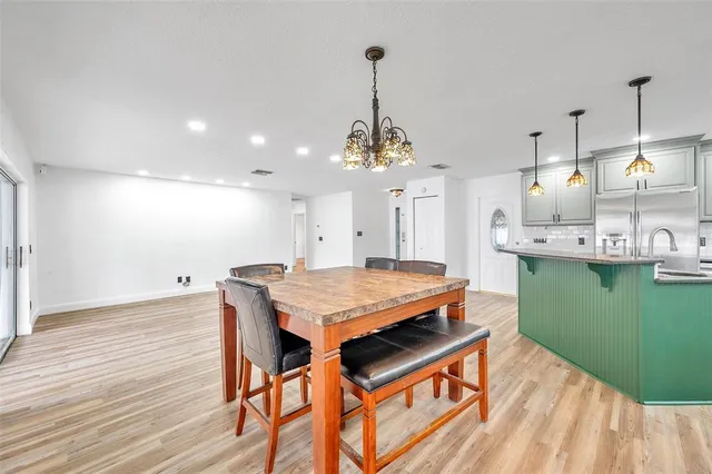 a kitchen with counter top space sink and cabinets