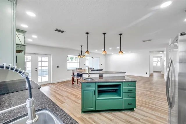 a view of room with window and wooden floor