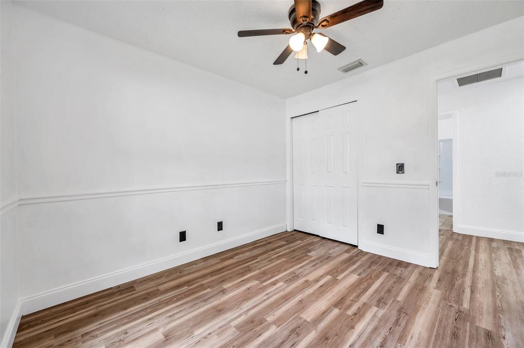 1520 Windmill Pointe Road Palm Harbor, FL 34685 - Photo 26 of 64 a view of room with window and wooden floor