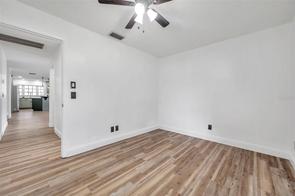 1520 Windmill Pointe Road Palm Harbor, FL 34685 - Photo 32 of 64 wooden floor in an empty room with a window