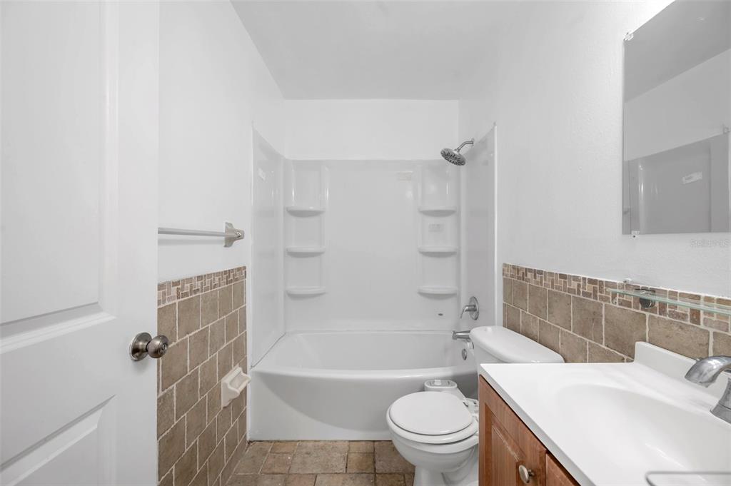 1520 Windmill Pointe Road Palm Harbor, FL 34685 - Photo 35 of 64 a bathroom with a sink toilet and bathtub