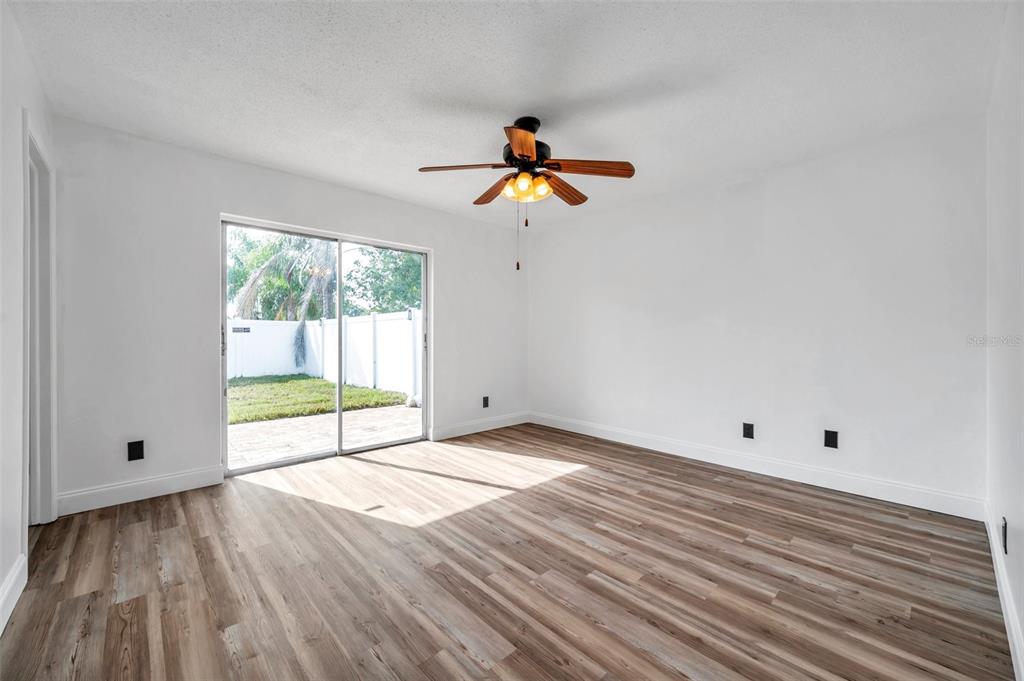 1520 Windmill Pointe Road Palm Harbor, FL 34685 - Photo 36 of 64 a view of an empty room with wooden floor and a window