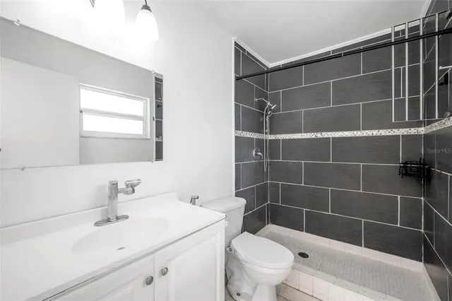 a view of a house with backyard and porch