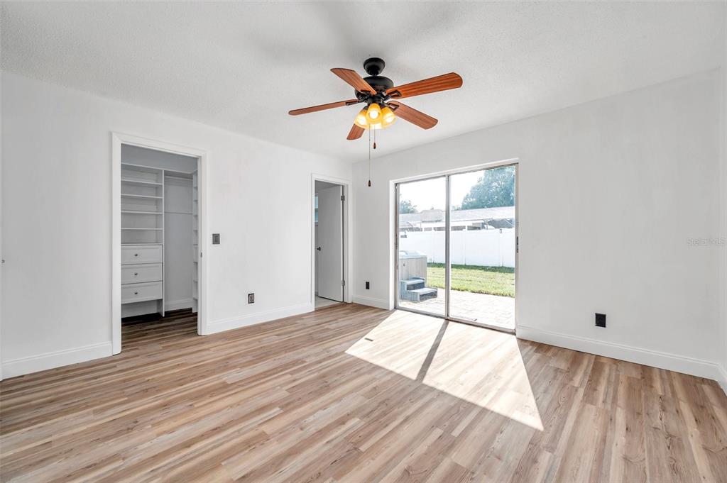 1520 Windmill Pointe Road Palm Harbor, FL 34685 - Photo 42 of 64 wooden floor in an empty room with a window