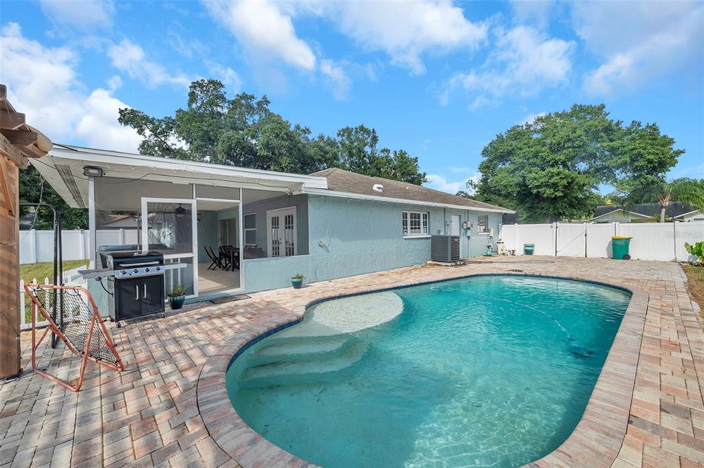 1520 Windmill Pointe Road Palm Harbor, FL 34685 - Photo 47 of 64 a view of house with swimming pool and sitting area