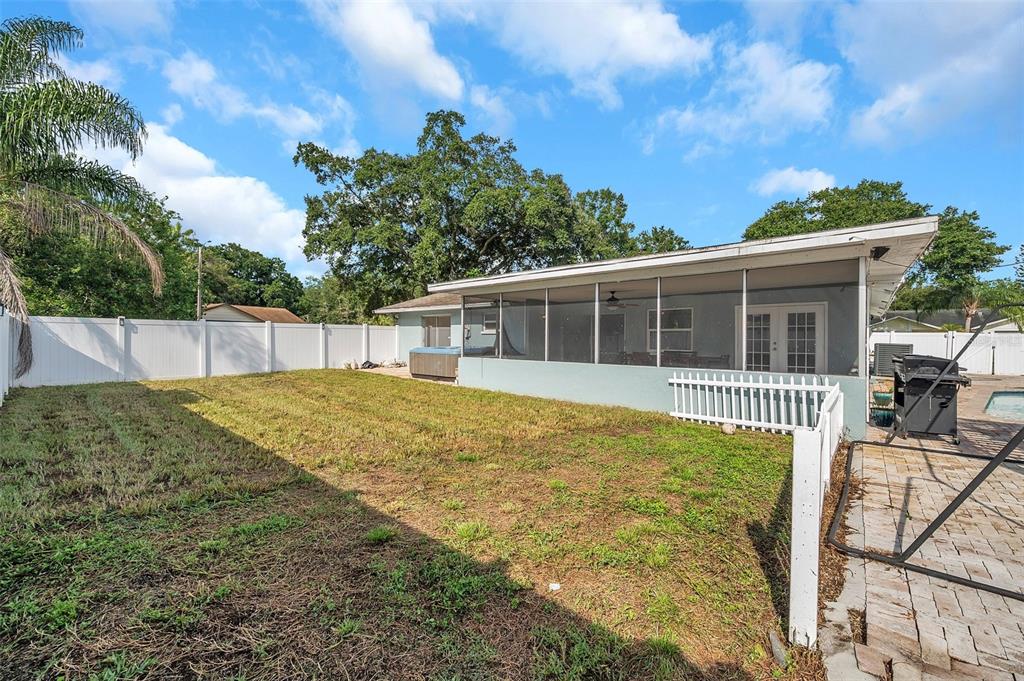 1520 Windmill Pointe Road Palm Harbor, FL 34685 - Photo 51 of 64 a view of a house with backyard and sitting area
