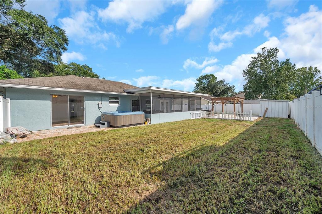 1520 Windmill Pointe Road Palm Harbor, FL 34685 - Photo 52 of 64 a view of a house with backyard and porch