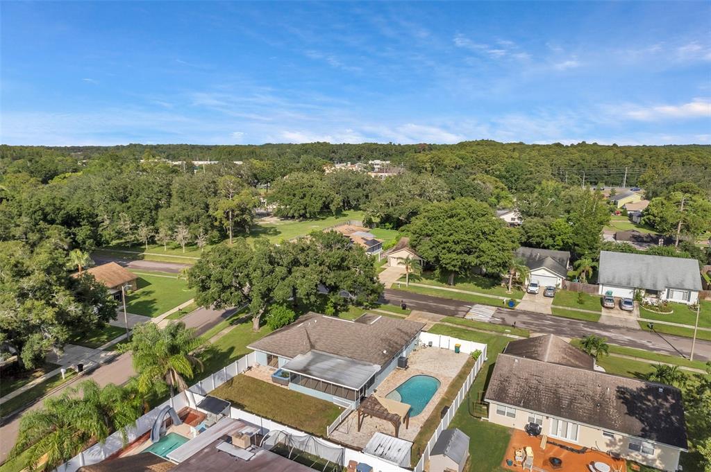 1520 Windmill Pointe Road Palm Harbor, FL 34685 - Photo 59 of 64 an aerial view of residential houses with outdoor space and city view