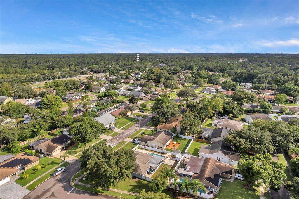 1520 Windmill Pointe Road Palm Harbor, FL 34685 - Photo 64 of 64 an aerial view of residential building with green space