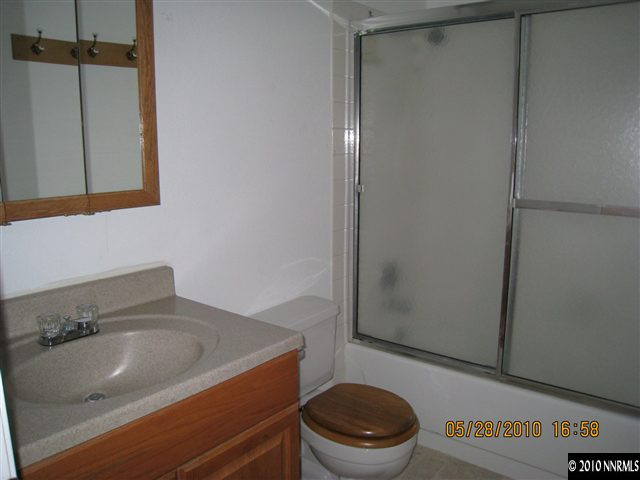 3908 Kings Row Reno, NV 89503 - Photo 6 of 8 a bathroom with a sink a toilet and a shower