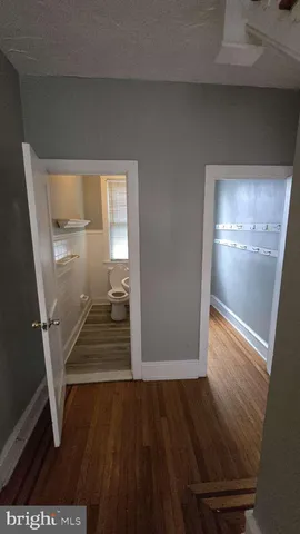 a view of entryway with wooden floor
