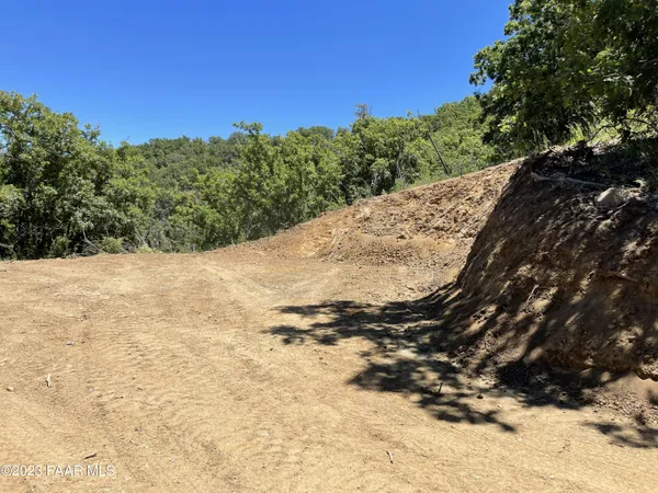 a view of a yard covered with snow in back