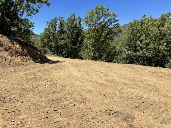 a view of snow on the side of a road