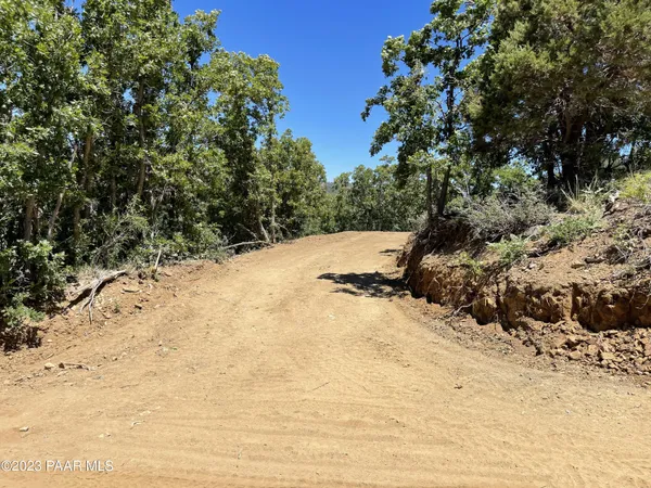 a view of a snow on the road