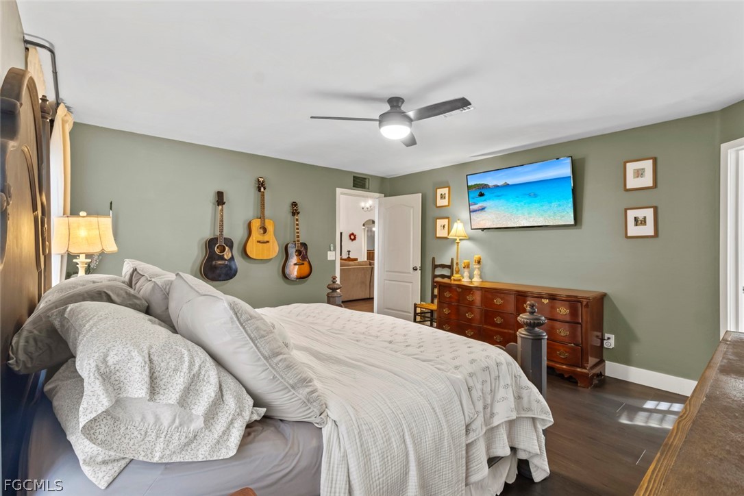 3610 65th Street West Lehigh Acres, FL 33971 - Photo 12 of 33 a bedroom with a bed and dresser