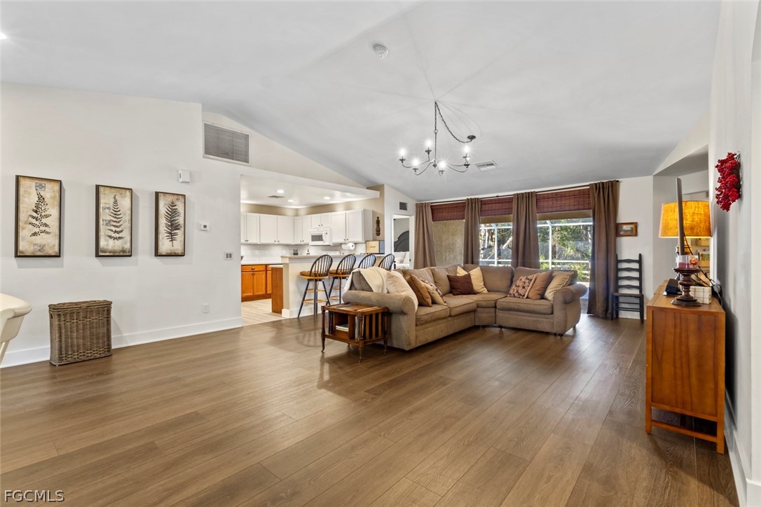 3610 65th Street West Lehigh Acres, FL 33971 - Photo 19 of 33 a living room with furniture and wooden floor