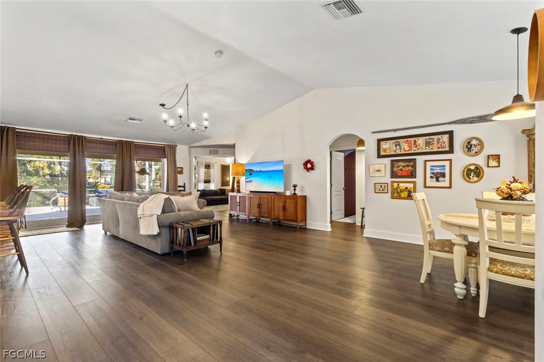 3610 65th Street West Lehigh Acres, FL 33971 - Photo 20 of 33 a living room with furniture and wooden floor