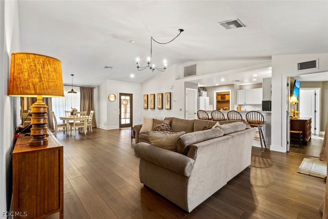 3610 65th Street West Lehigh Acres, FL 33971 - Photo 21 of 33 a living room with furniture and wooden floor