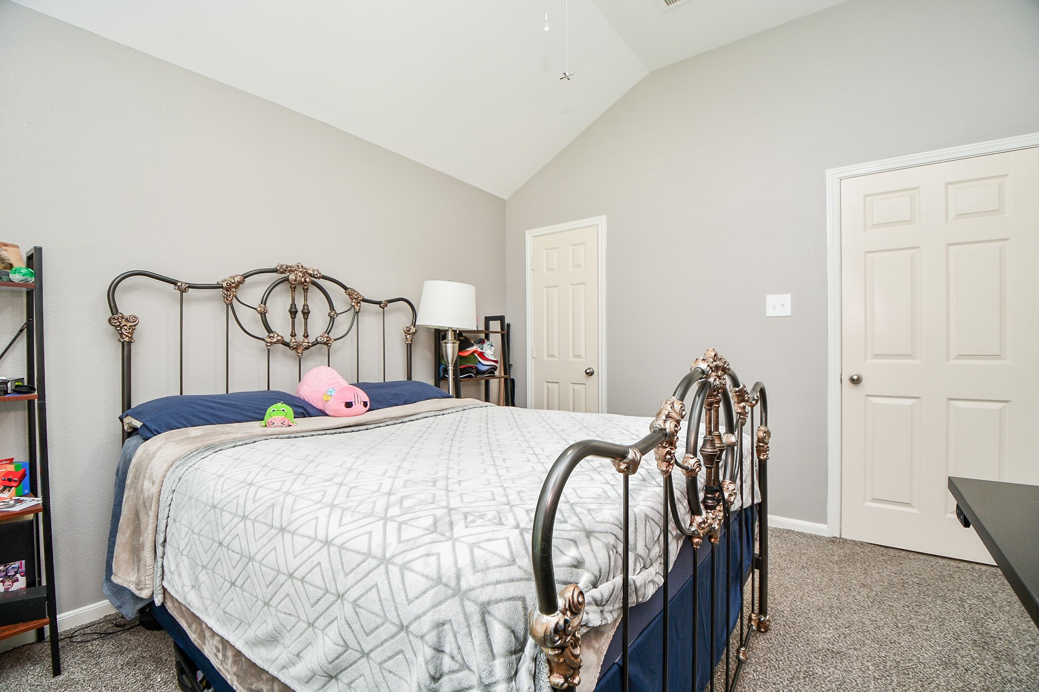 5324 Troutline Lane Rosenberg, TX 77471 - Photo 24 of 30 a bed sitting in a bedroom next to a cabinet