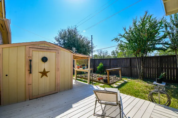 a balcony with table and chairs