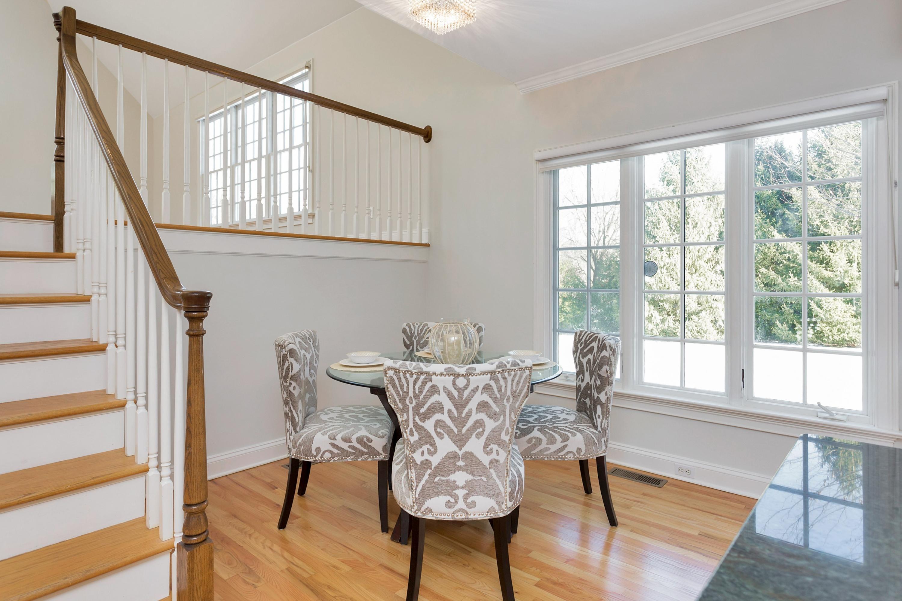 244 Hollow Tree Ridge Road Darien, CT 06820 - Photo 19 of 38 a view of a dining room with furniture window and wooden floor