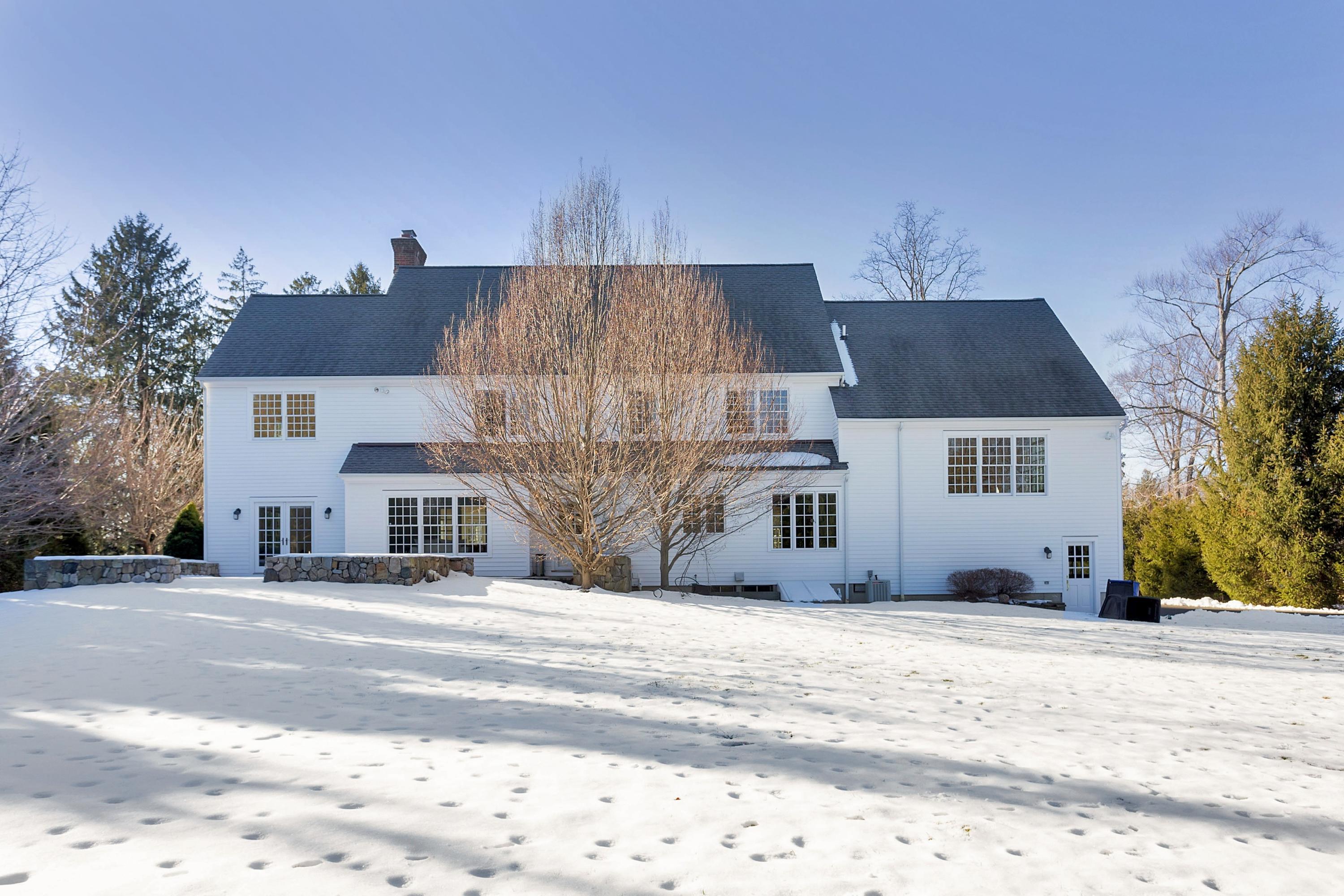 244 Hollow Tree Ridge Road Darien, CT 06820 - Photo 34 of 38 a view of a house with a snow on the road