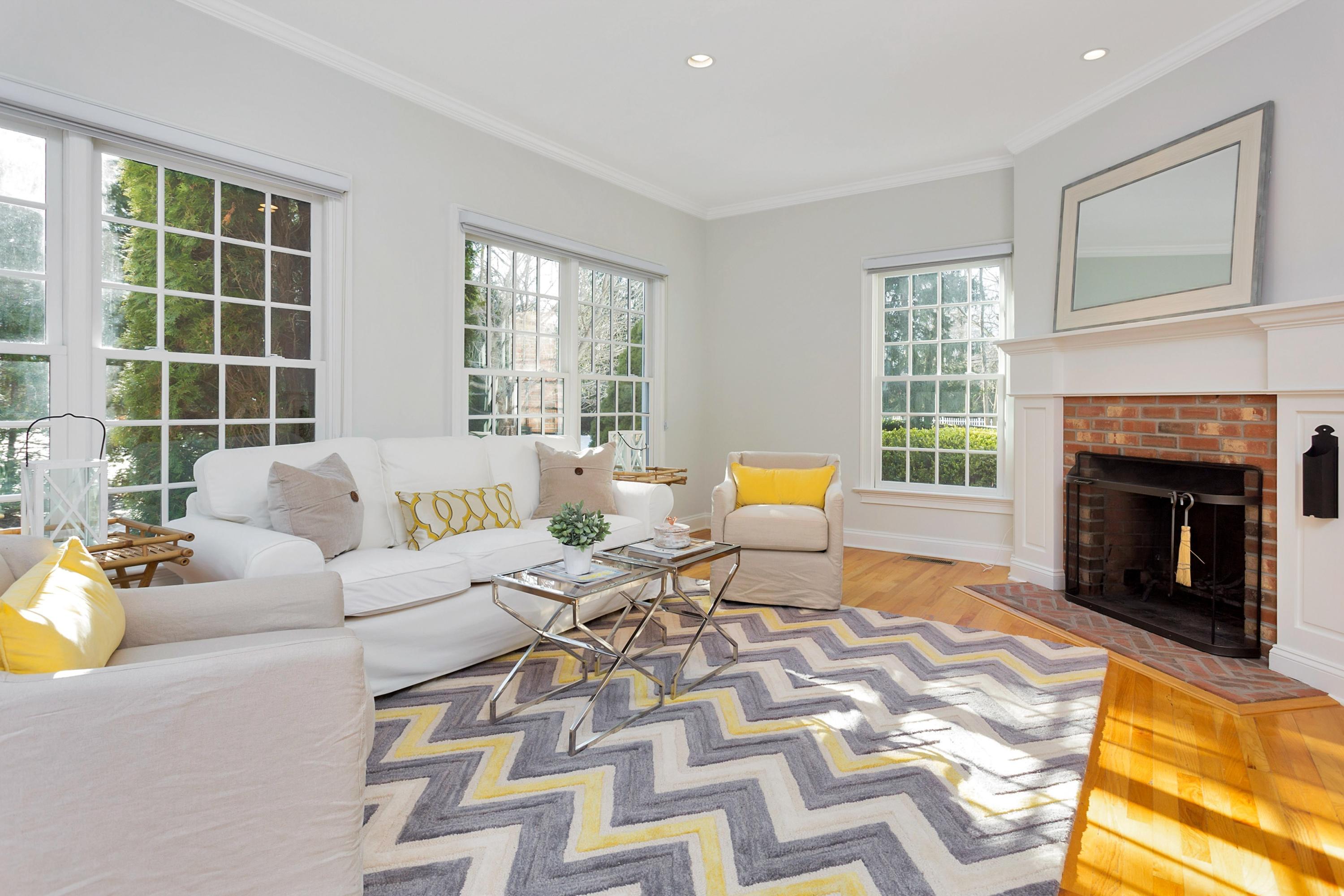 244 Hollow Tree Ridge Road Darien, CT 06820 - Photo 10 of 38 a living room with furniture and a fireplace