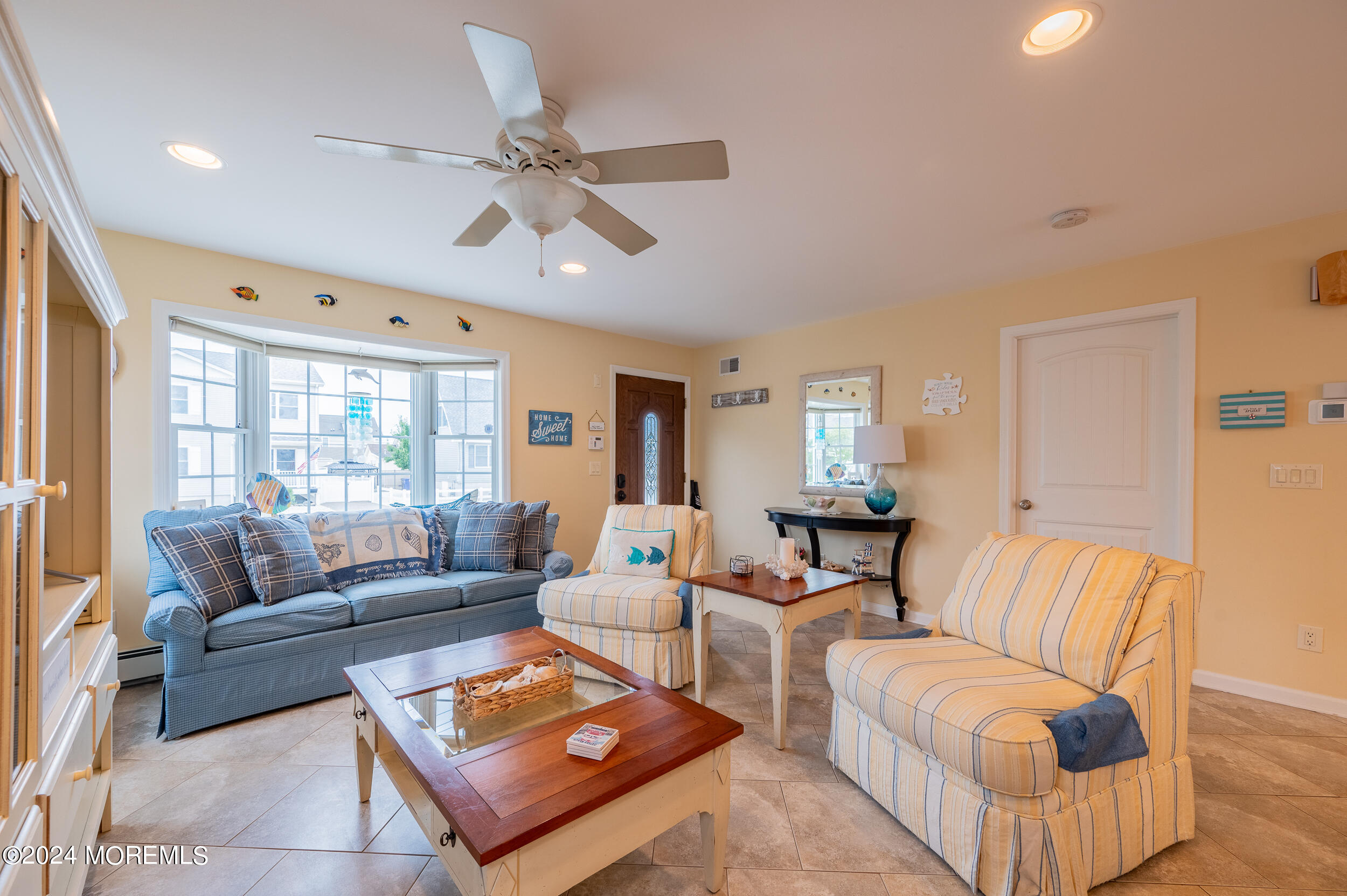 219 3rd Avenue Seaside Heights, NJ 08751 - Photo 11 of 27 a living room with furniture and a large window