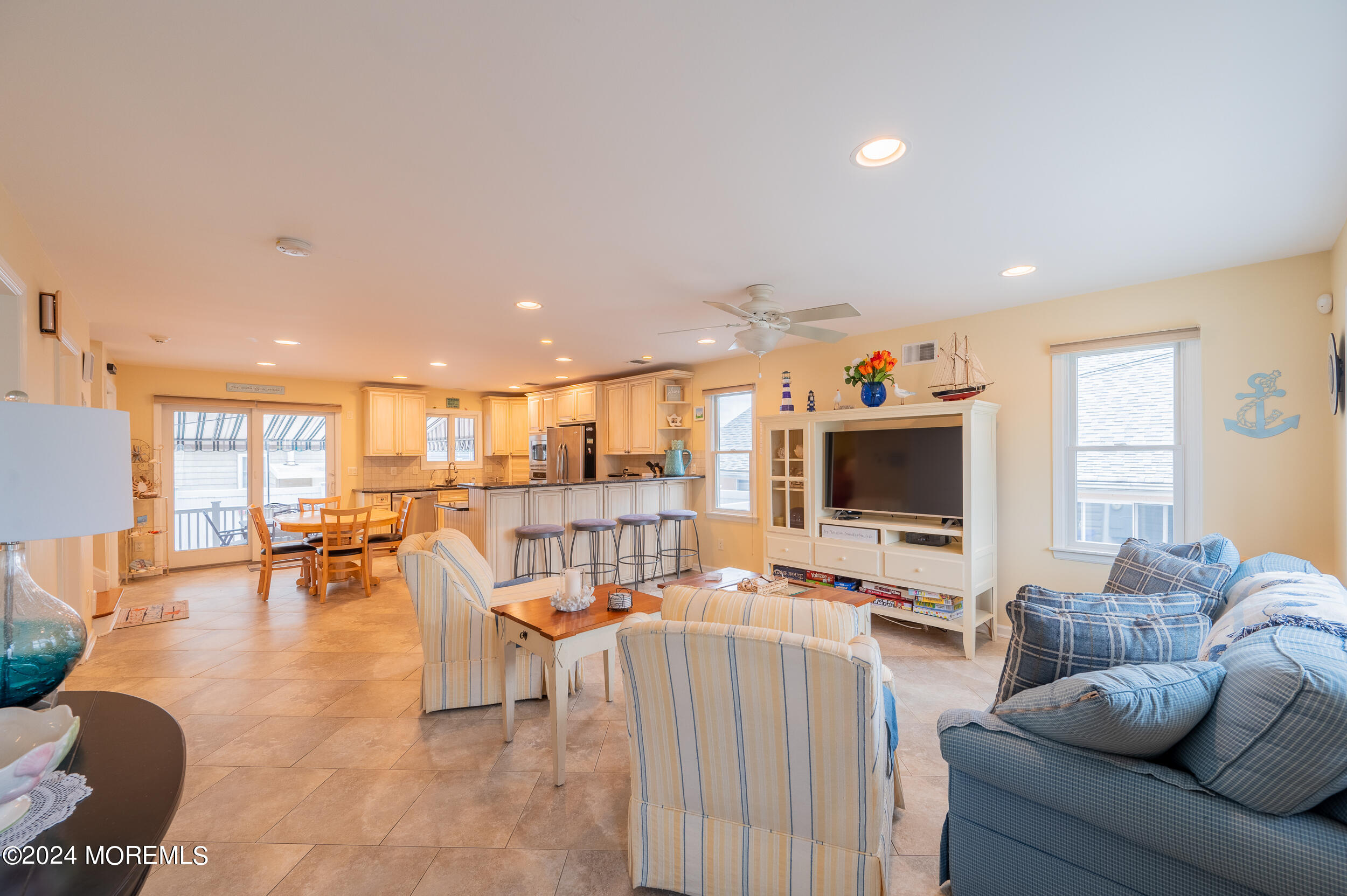 219 3rd Avenue Seaside Heights, NJ 08751 - Photo 13 of 27 a living room with furniture and a flat screen tv
