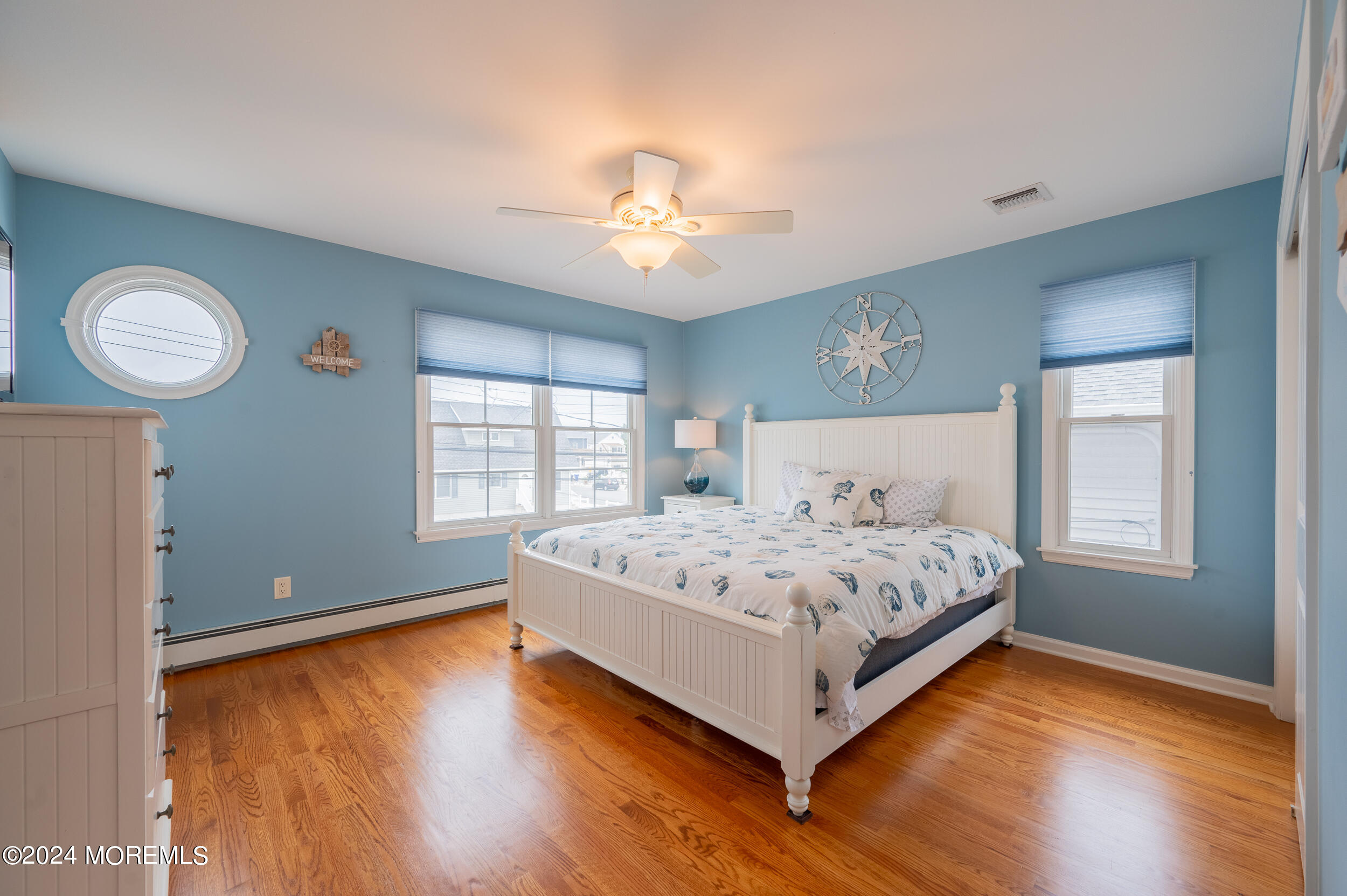 219 3rd Avenue Seaside Heights, NJ 08751 - Photo 15 of 27 a spacious bedroom with a bed and a window