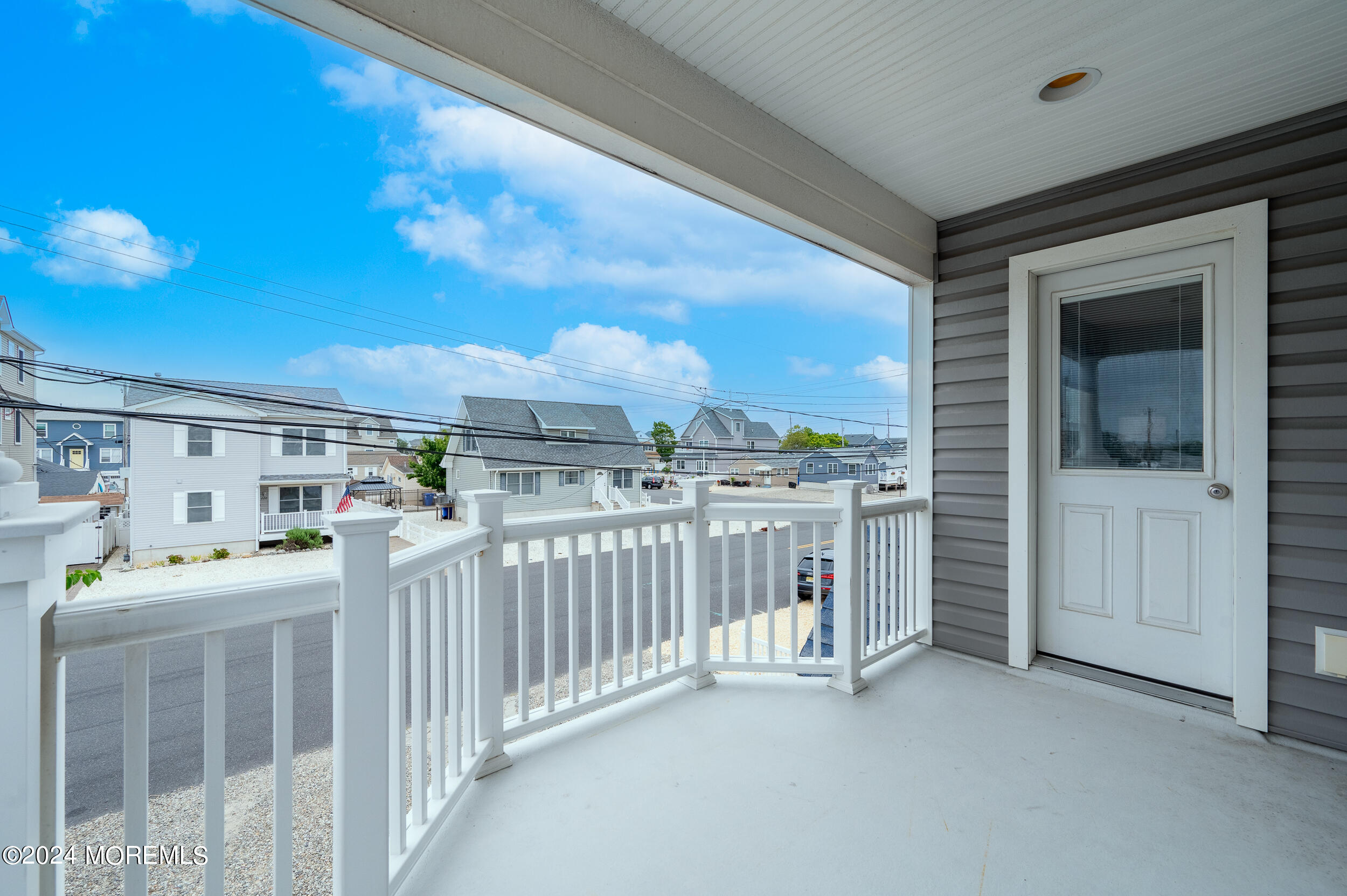 219 3rd Avenue Seaside Heights, NJ 08751 - Photo 21 of 27 a bedroom with furniture and a large window