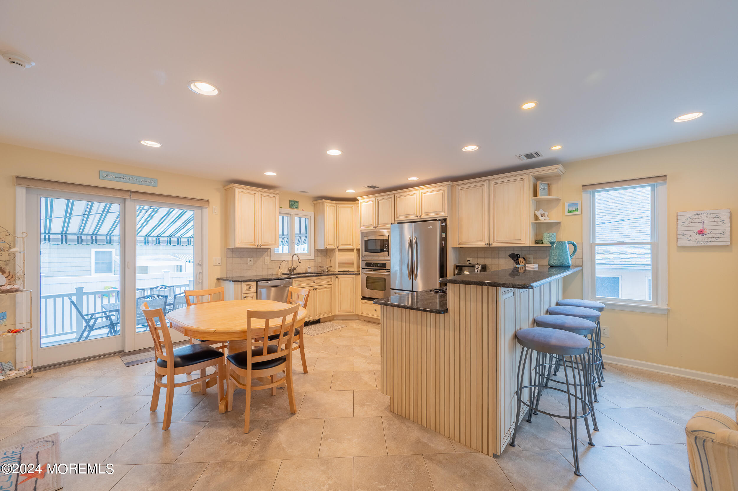 219 3rd Avenue Seaside Heights, NJ 08751 - Photo 3 of 27 a view of a dining room with furniture window and wooden floor