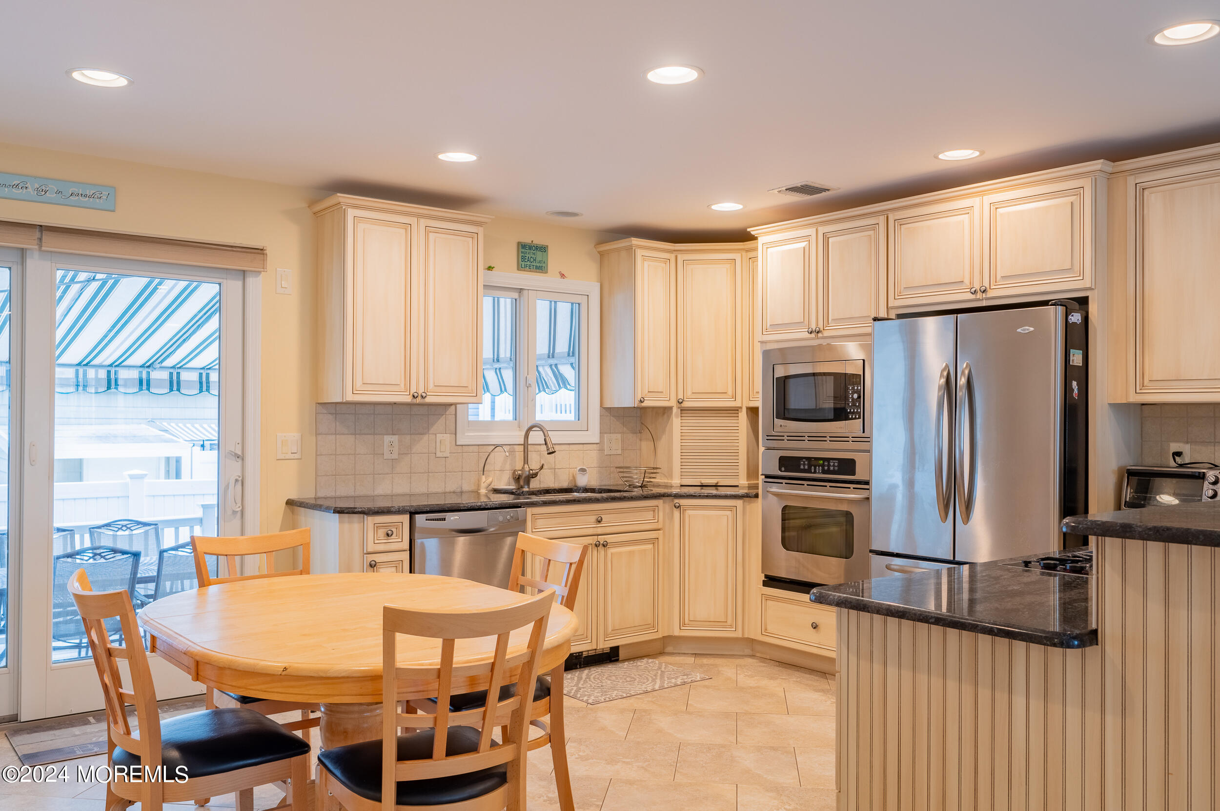 219 3rd Avenue Seaside Heights, NJ 08751 - Photo 4 of 27 a kitchen with stainless steel appliances a refrigerator a stove a sink and a refrigerator