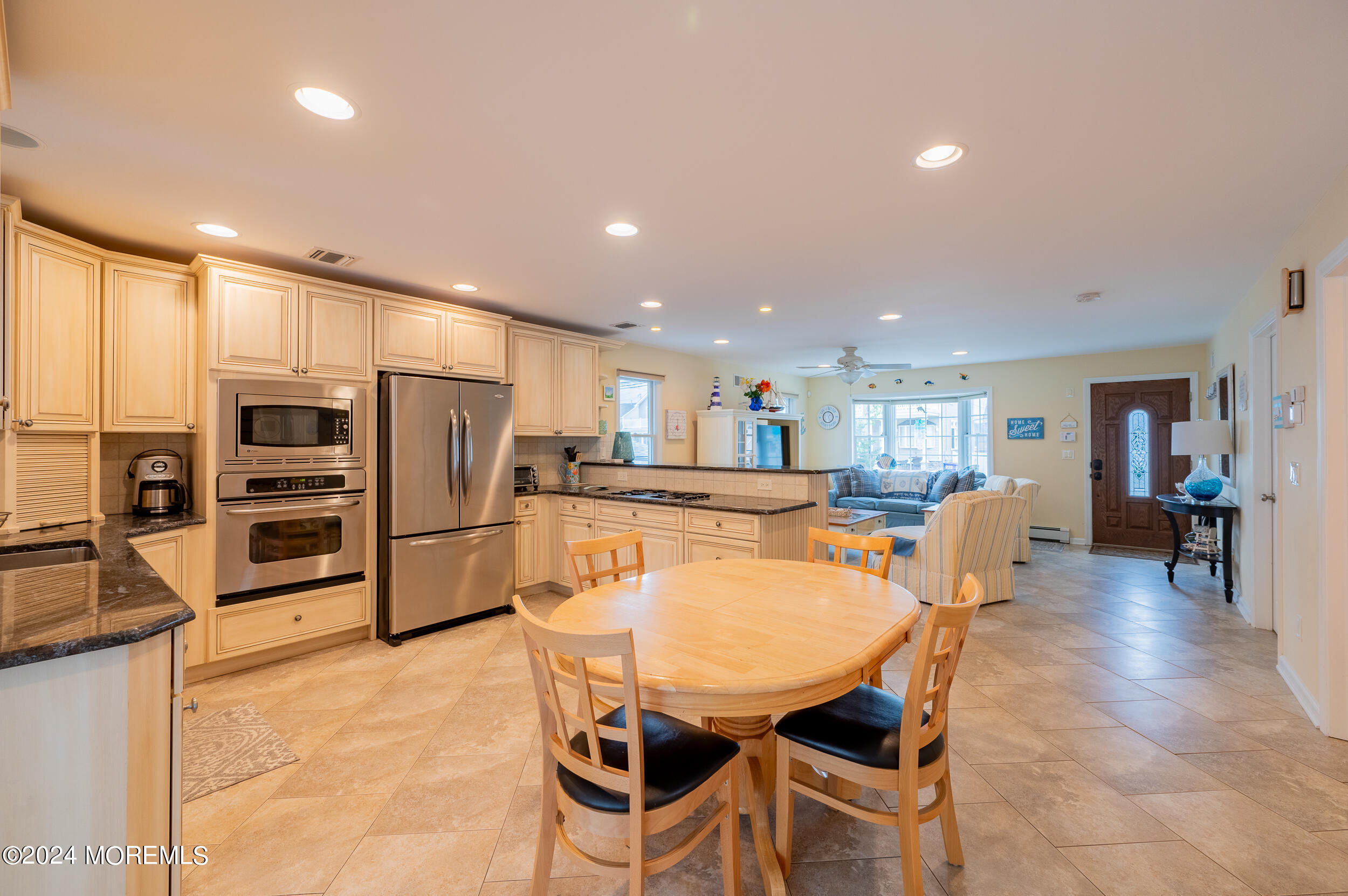 219 3rd Avenue Seaside Heights, NJ 08751 - Photo 6 of 27 a dining room with stainless steel appliances furniture a refrigerator and kitchen view