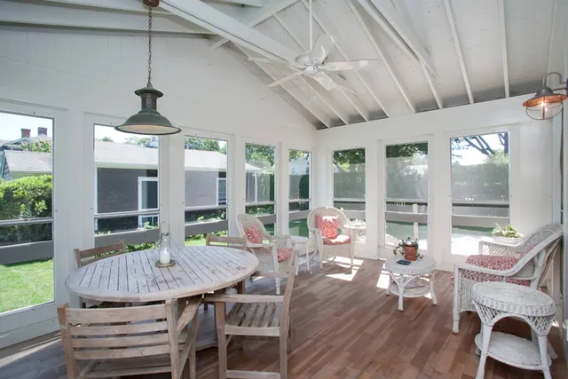 a view of a livingroom with furniture window and wooden floor